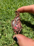 Handmade Opalized Red Ammolite from Canada Pendant Wrapped in Copper
